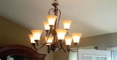 Classic ceiling chandelier installation with warm lighting in Lancaster, PA