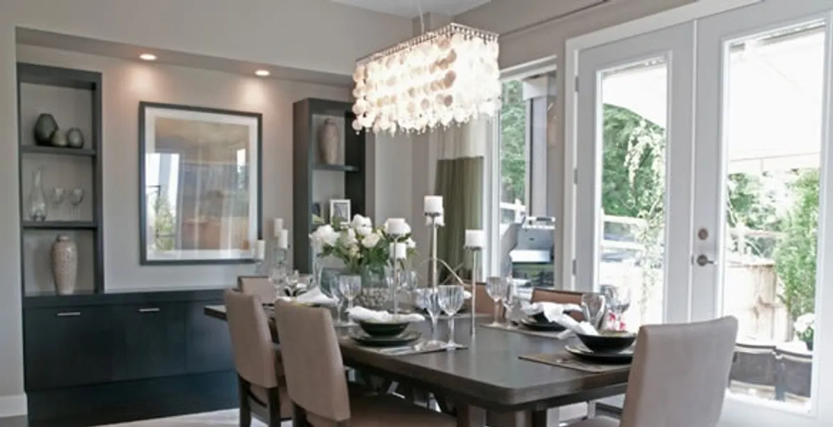 Elegant dining room chandelier installation above table in Lancaster, PA