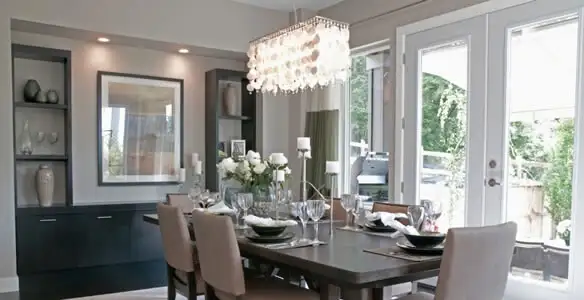 Elegant dining room chandelier installation above table in Lancaster, PA