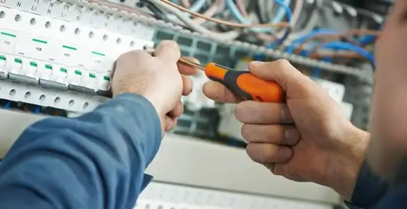 electrical service showing licensed electrician performing electrical panel maintenance and adjustments in Lancaster, PA