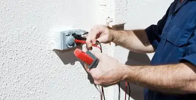 Electrician performing home electrical outlet and wiring inspection in Lancaster, PA