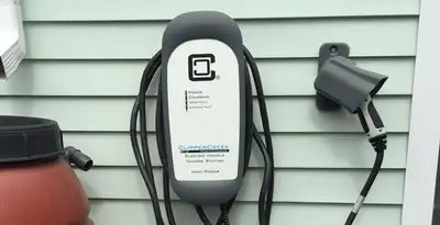 Outdoor electric vehicle charger installation on residential wall in Lancaster, PA